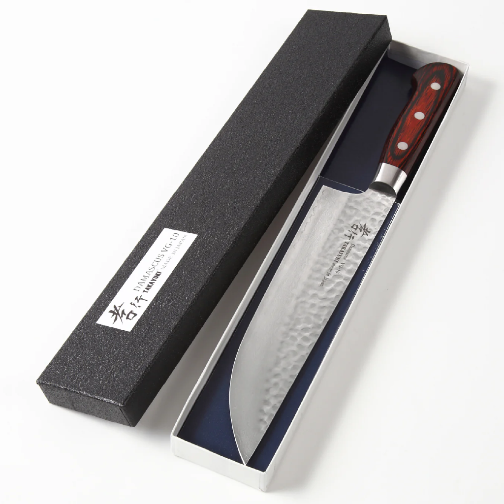 Chef's knife with handle in a black box on a white background