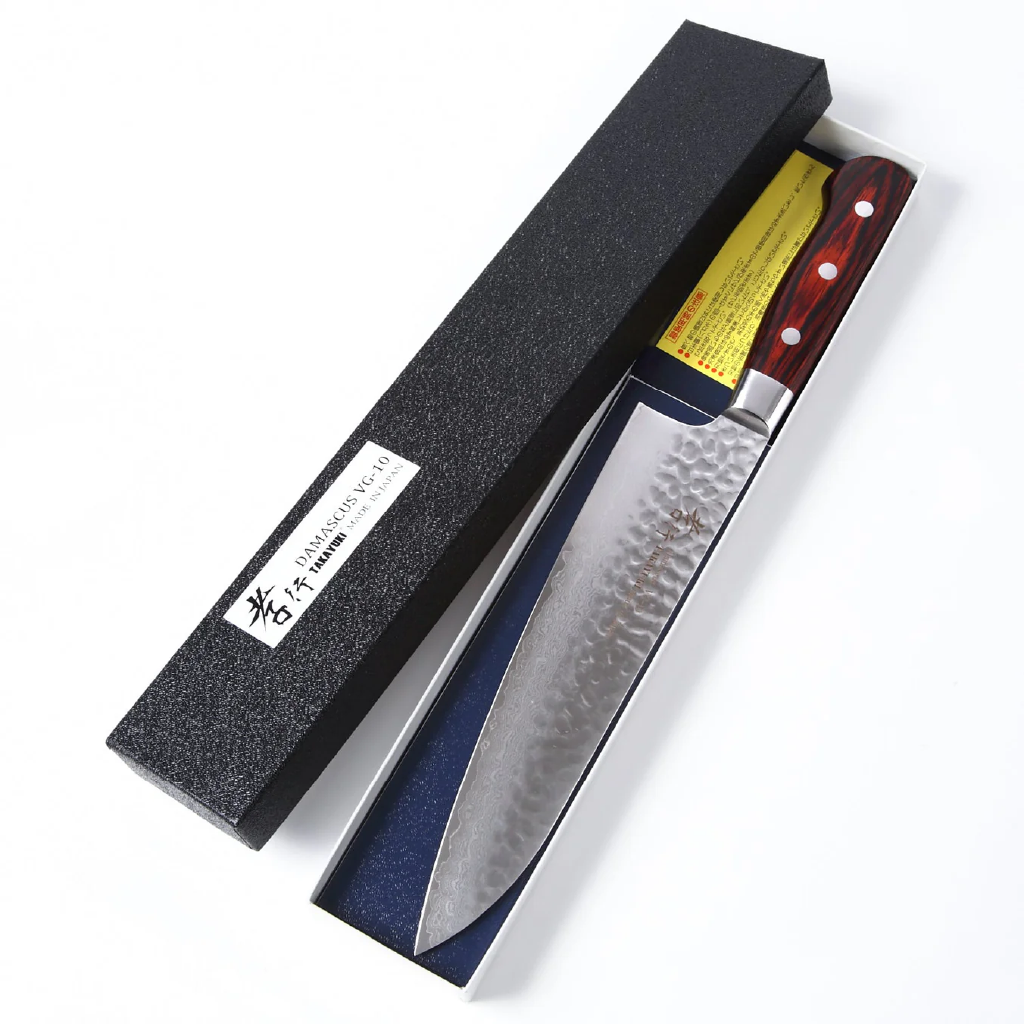 Chef's knife with a wooden handle in a black sheath on a white background