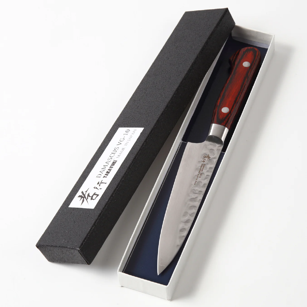 Paring knife with handle in a black and white box on a white background