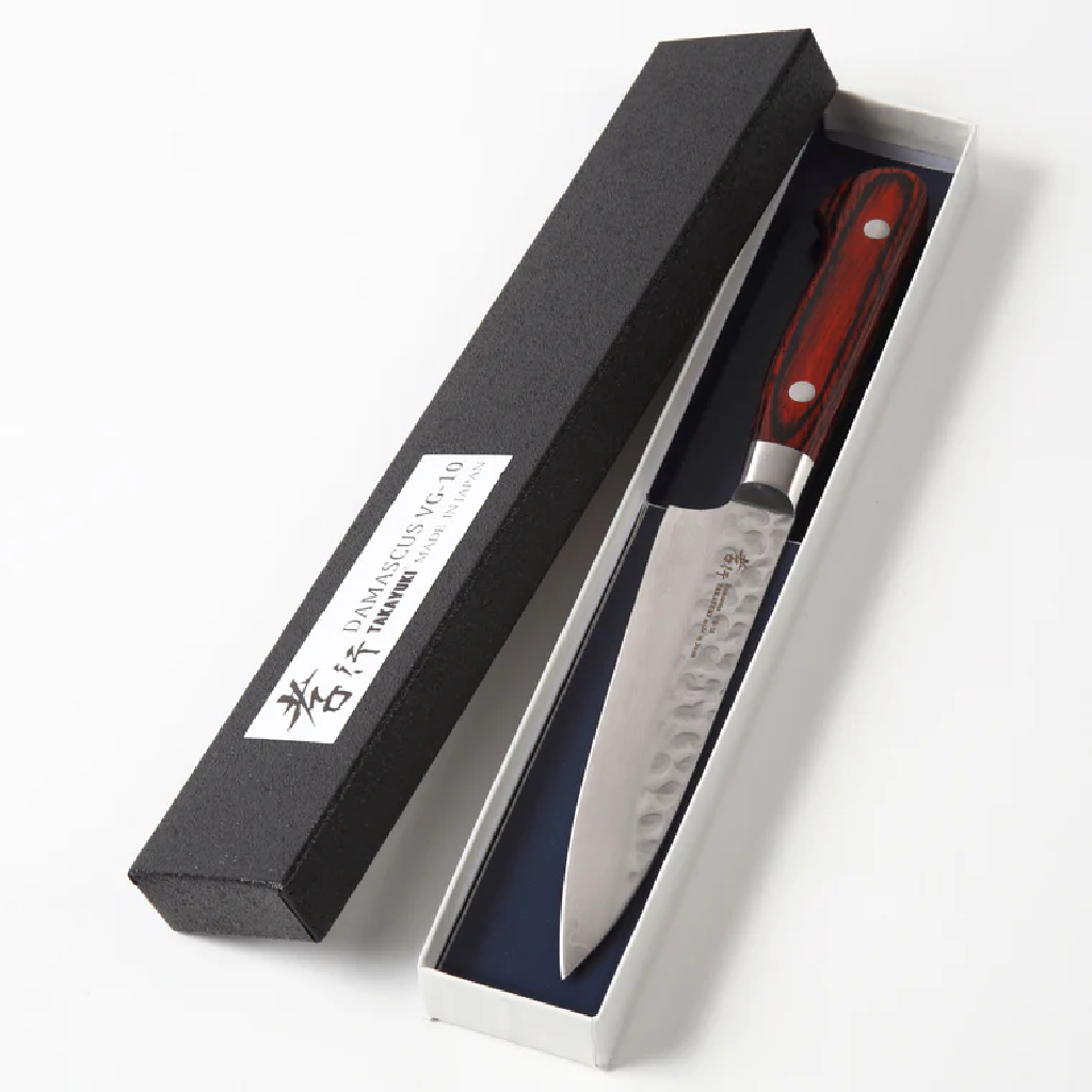 Paring knife with handle in a black and white box on a white background