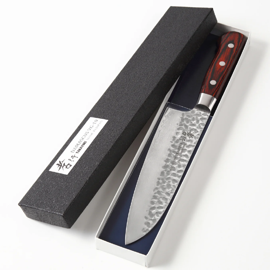 Santoku knife with a handle in a black box on a white background