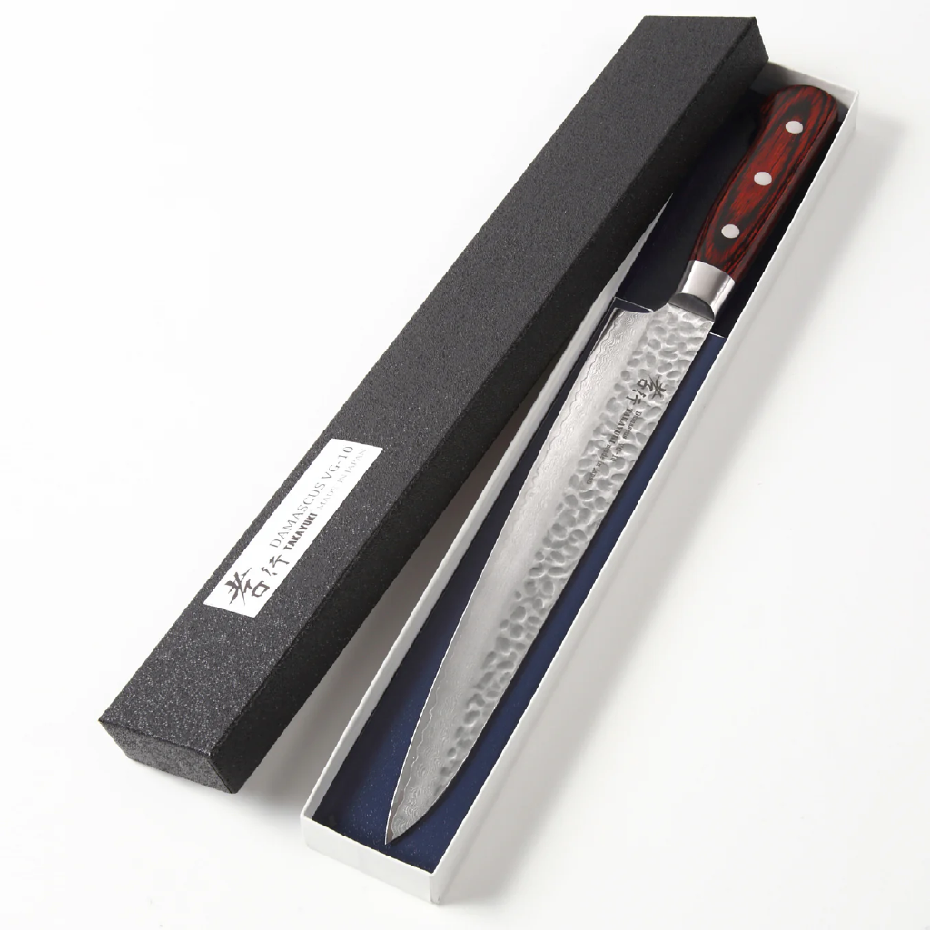 Japanese slicing knife with a handle in a black box on a white background